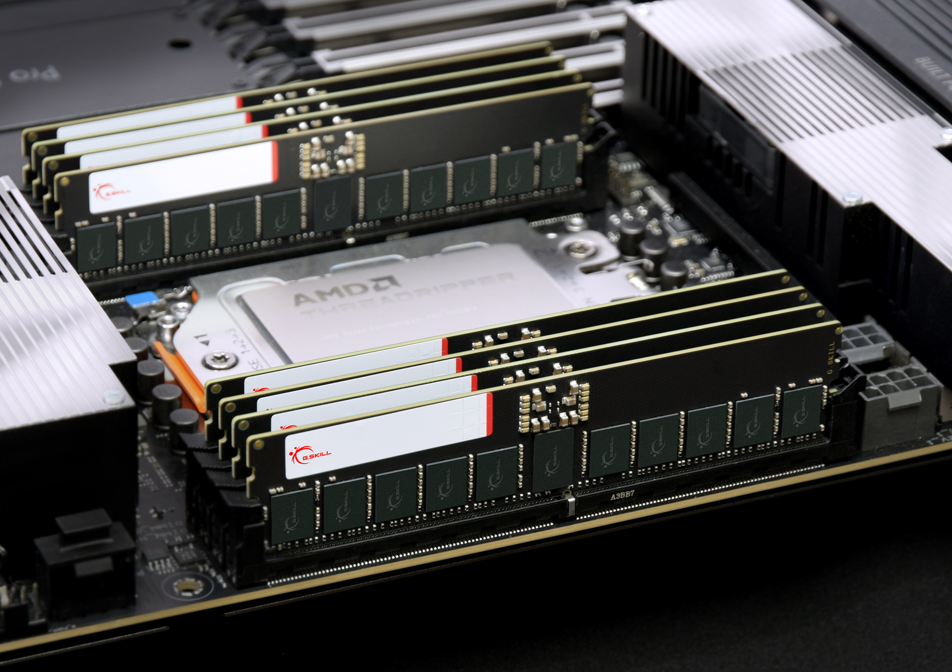 Close-up of high-performance RAM sticks and AMD CPU on a motherboard.