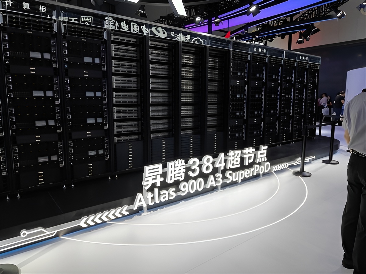 Large server cluster display labeled Atlas 900 A3 SuperPOD at a tech event.