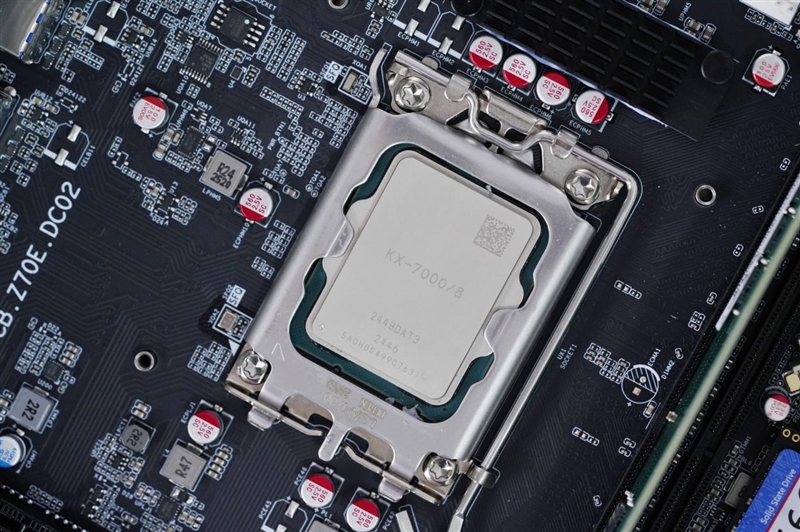 Close-up of a KX-7000/J CPU installed on a motherboard with surrounding circuitry and components.