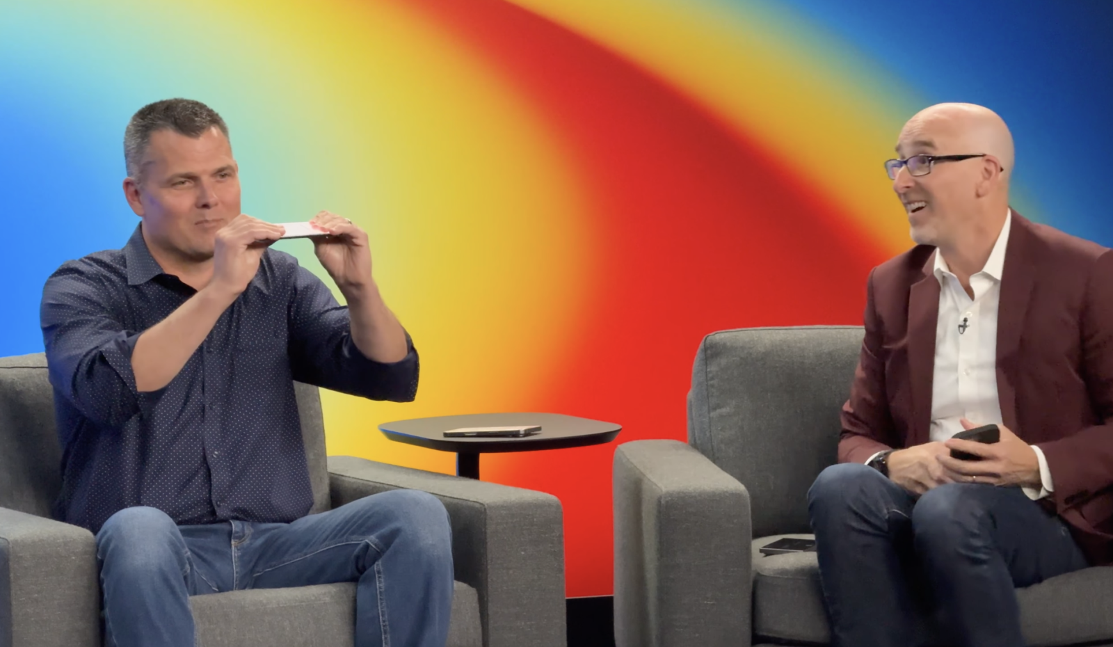 Apple executive demonstrates iPhone Air bending on stage, highlighting durability concerns and resilience against Bendgate fears.