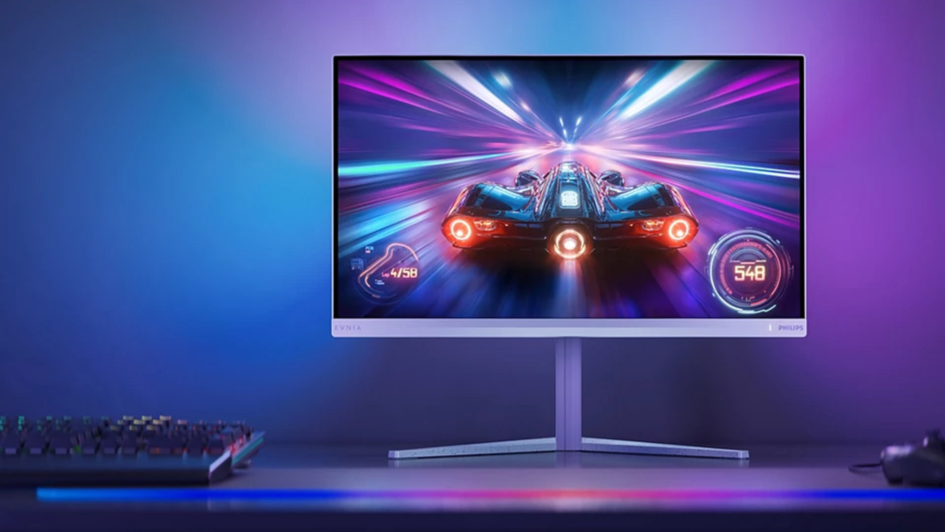 Philips Evnia monitor displaying a futuristic racing game with the text lap 4/58 and speed 548 on screen.