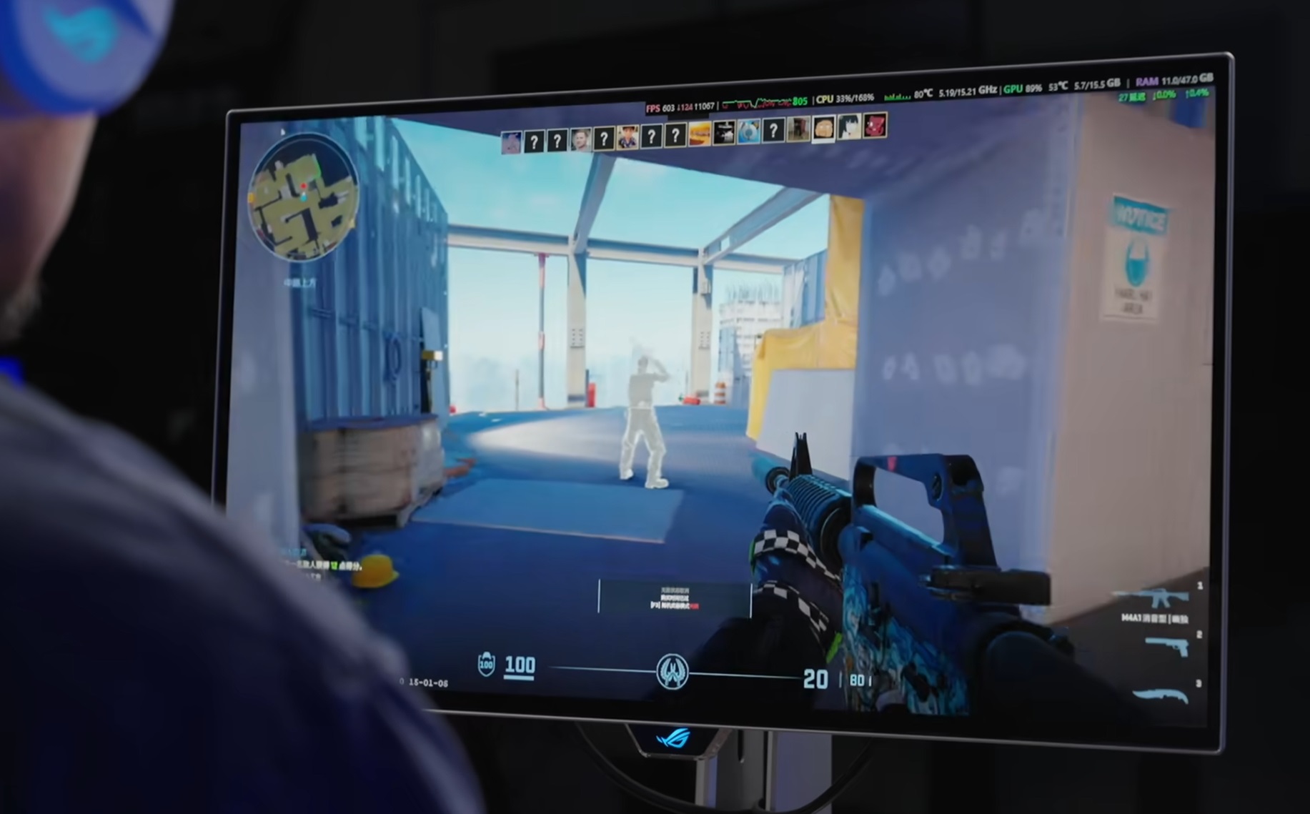 ASUS ROG monitor displays a first-person shooter game with an FPS of 603.