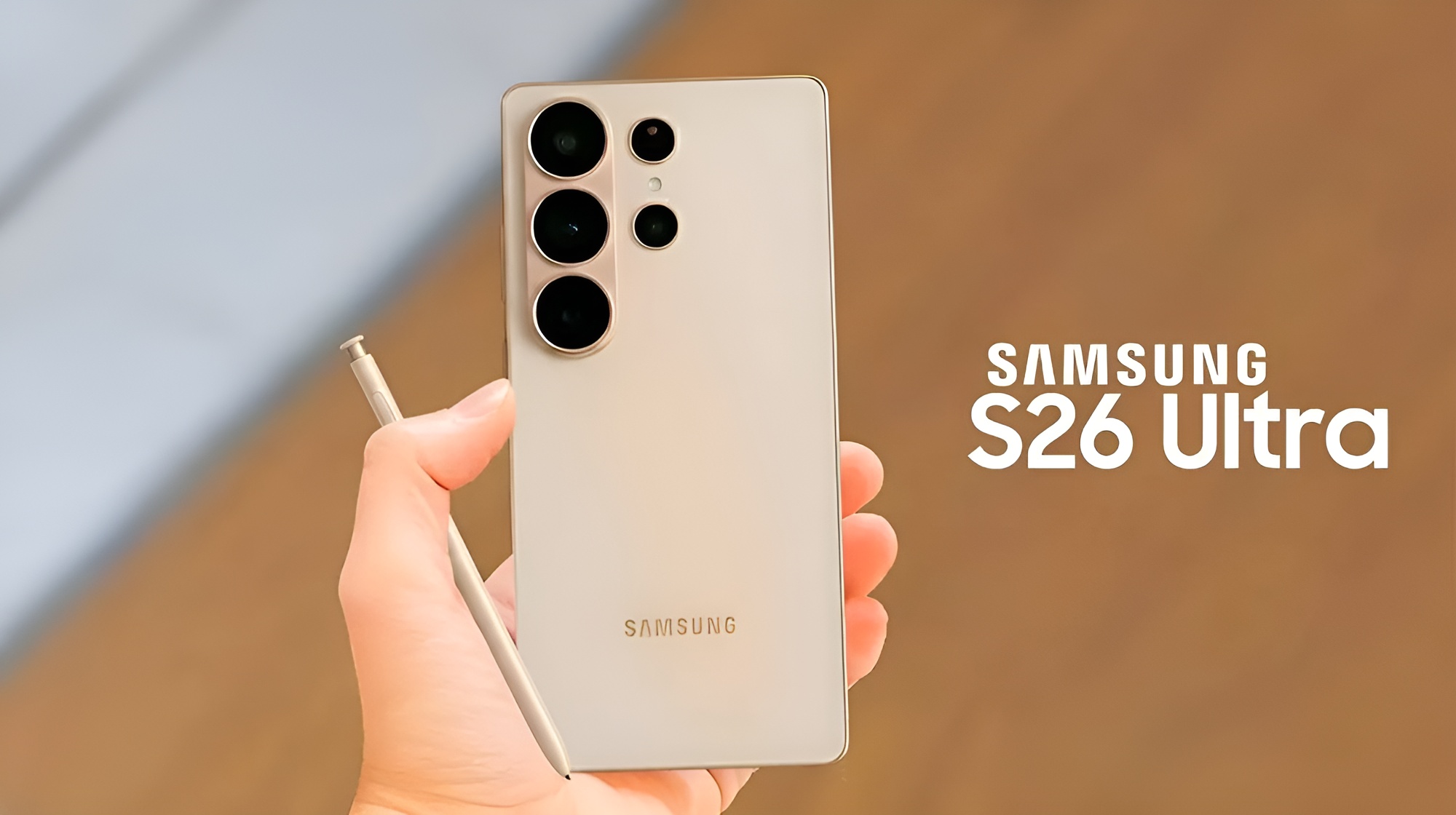 A person holds a Samsung S26 Ultra smartphone with an S Pen next to the device, with the brand name Samsung and model text 'S26 Ultra' visible in the background.