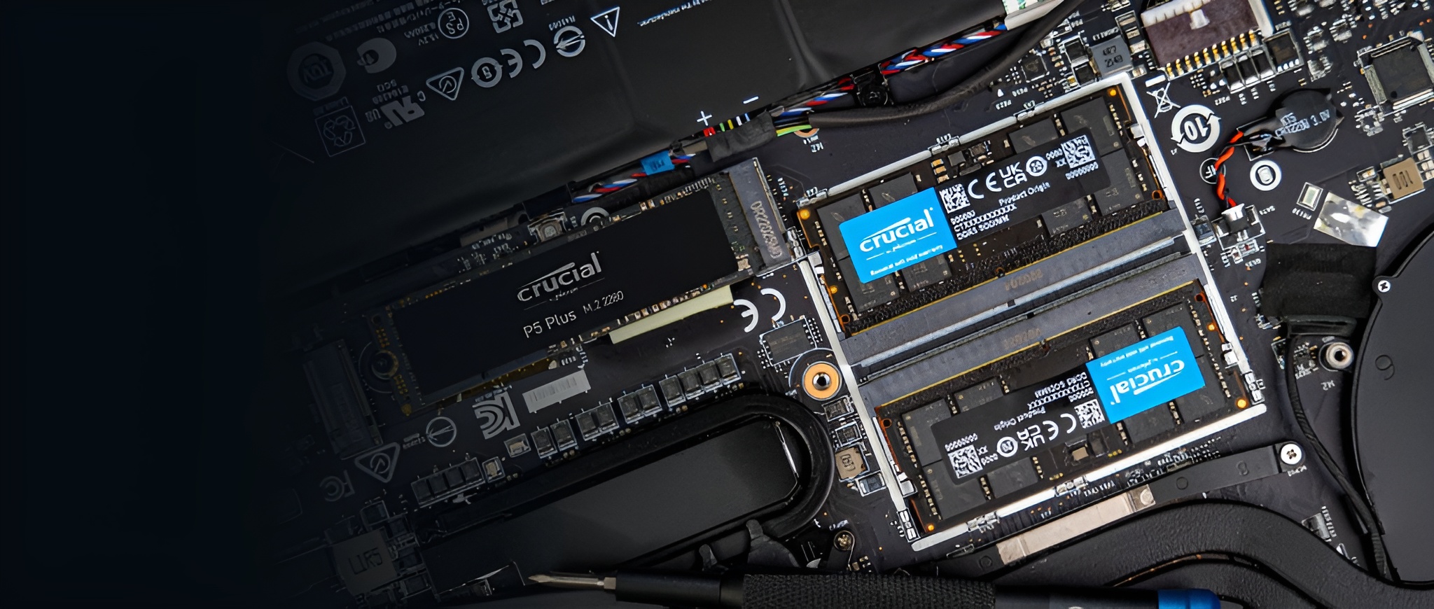 A Crucial P5 Plus M.2 NVMe SSD is installed on a motherboard alongside Crucial RAM modules.