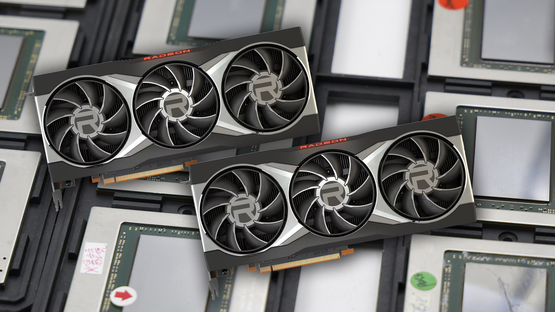 Two AMD Radeon graphics cards with triple fans over a background of what appear to be semiconductor components.