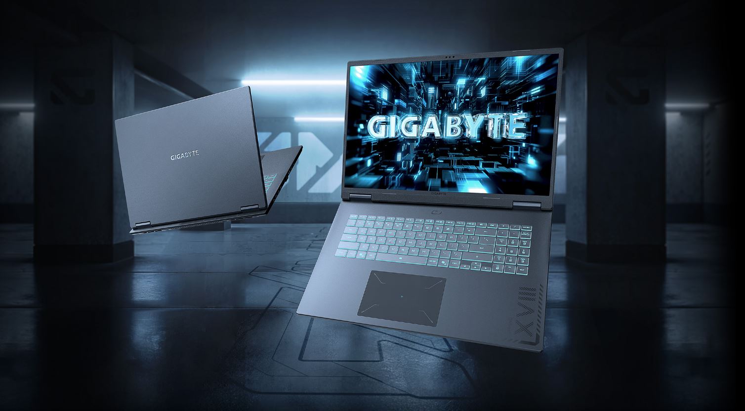 Two Gigabyte laptops, labeled as GIGABYTE, are shown floating in a futuristic, dark setting, with one screen displaying 'GIGABYTE'.