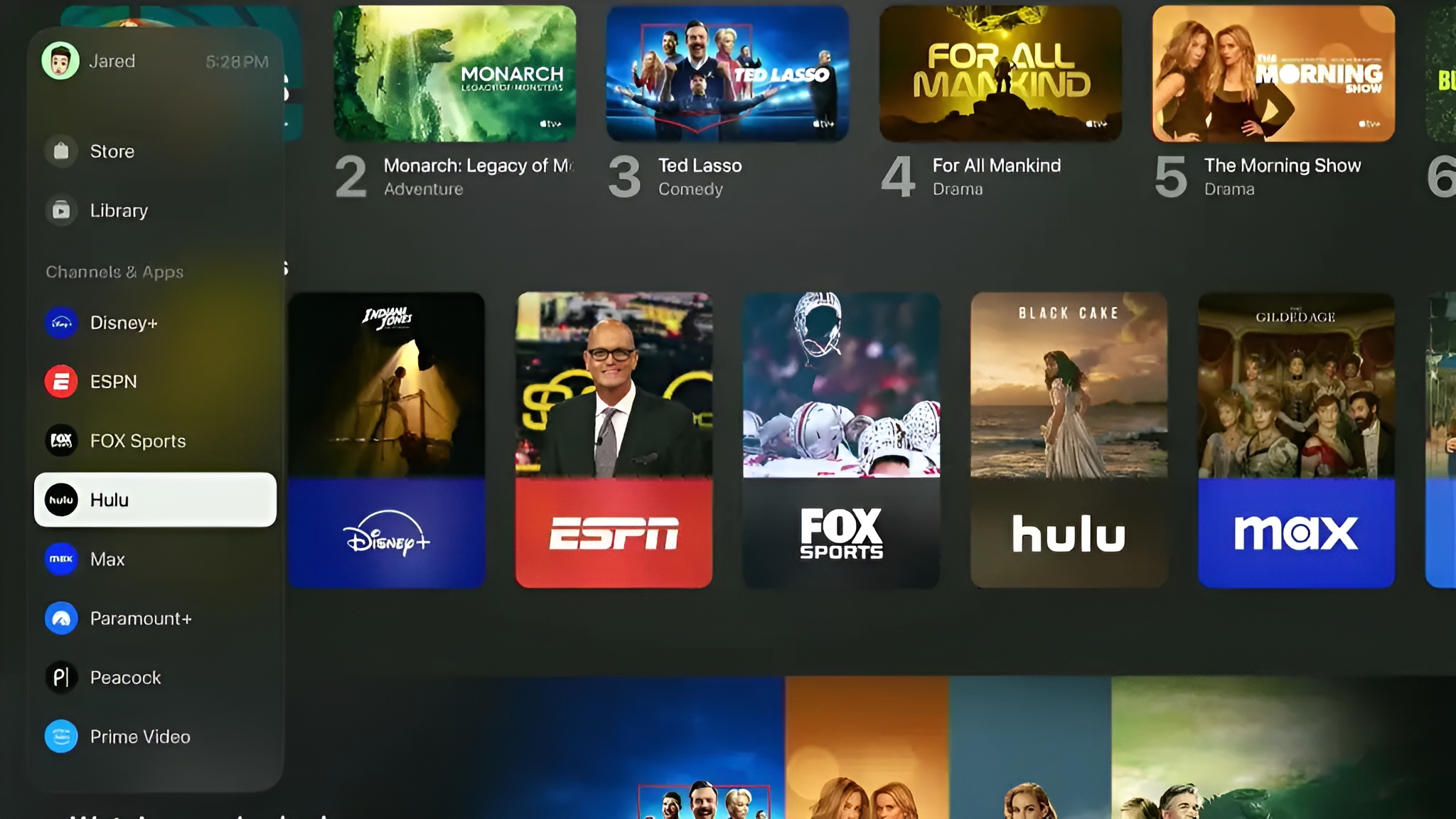 The on-screen interface displays a selection of streaming services including Hulu, Disney+, ESPN, FOX Sports, and Max, with