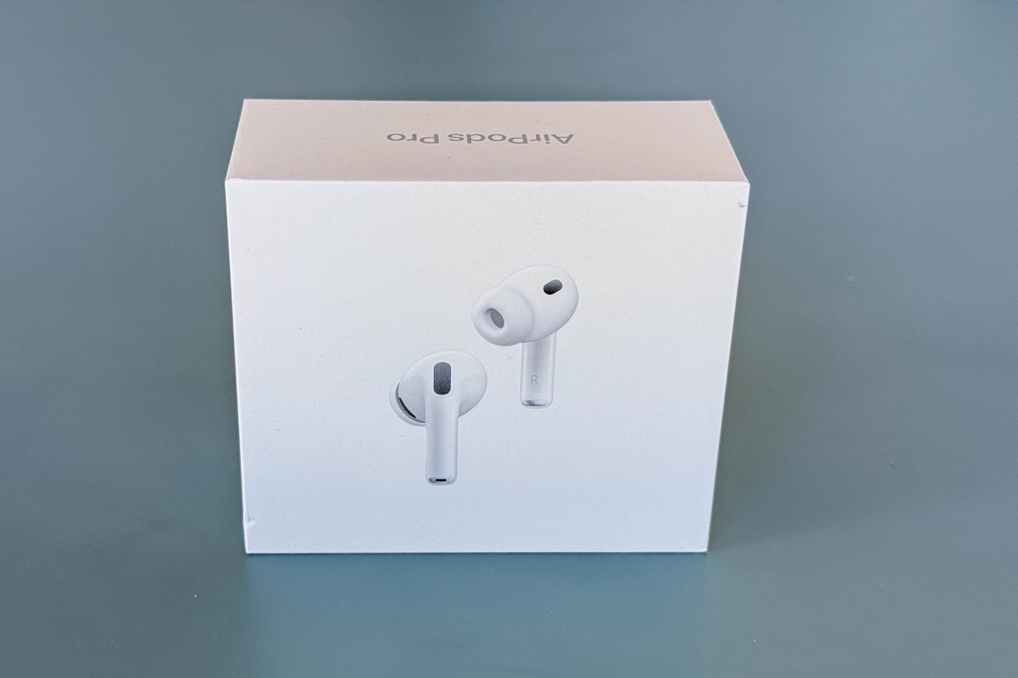 A box of Apple AirPods Pro showing an image of the earbuds on the front and 'AirPods Pro' text on the top.
