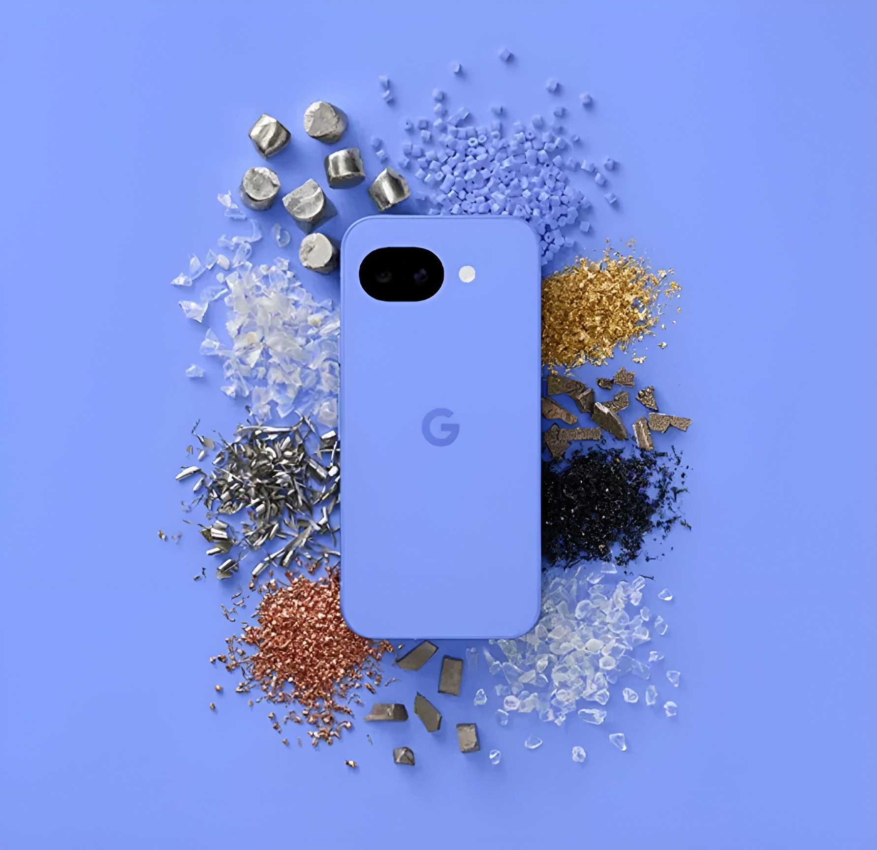 A blue Google Pixel device surrounded by various colored material fragments on a matching blue background.