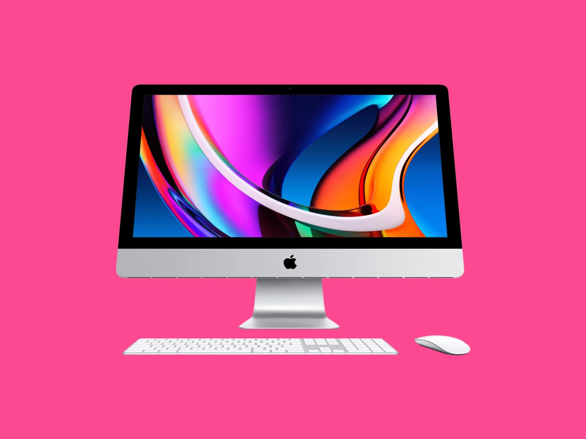 An Apple iMac with a colorful abstract wallpaper on the screen, set against a pink background alongside a white keyboard and mouse.