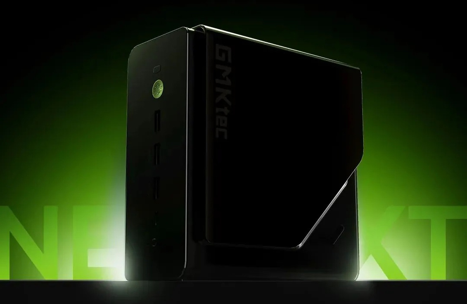 A GMKtec mini PC is displayed against a green background, showcasing its vertical design and multiple side ports.