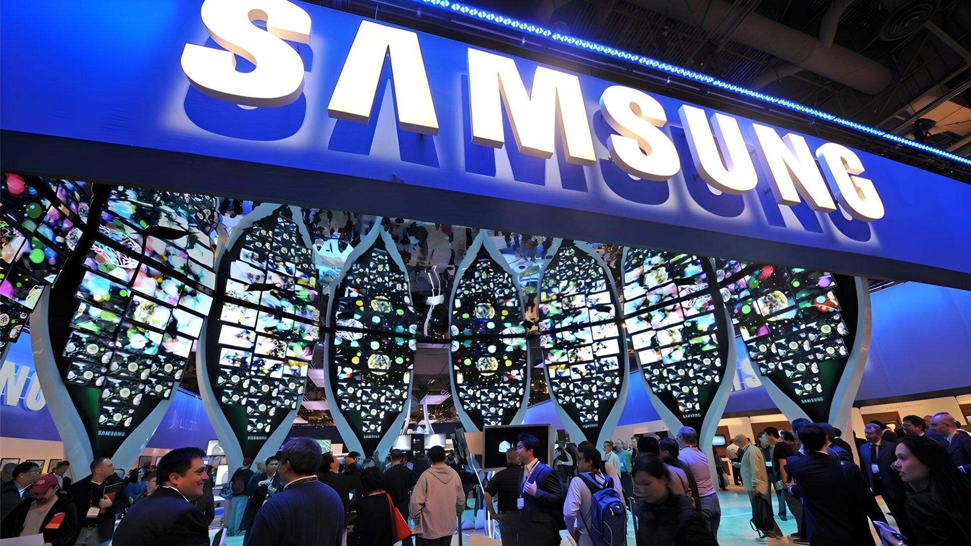 Visitors gather around a Samsung booth with large, leaf-shaped digital displays showcasing vibrant images at a tech convention.