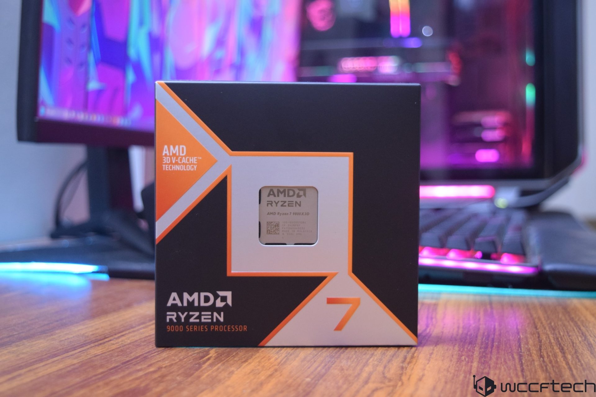 The image shows an AMD Ryzen 7 7900X3D processor box labeled with 'AMD 3D V-Cache Technology' and '9000 Series Processor' on