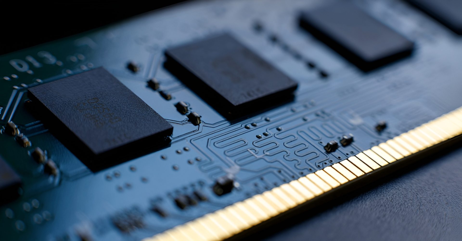 A close-up view of an unbranded computer RAM module highlighting the gold contact pins and circuit details.