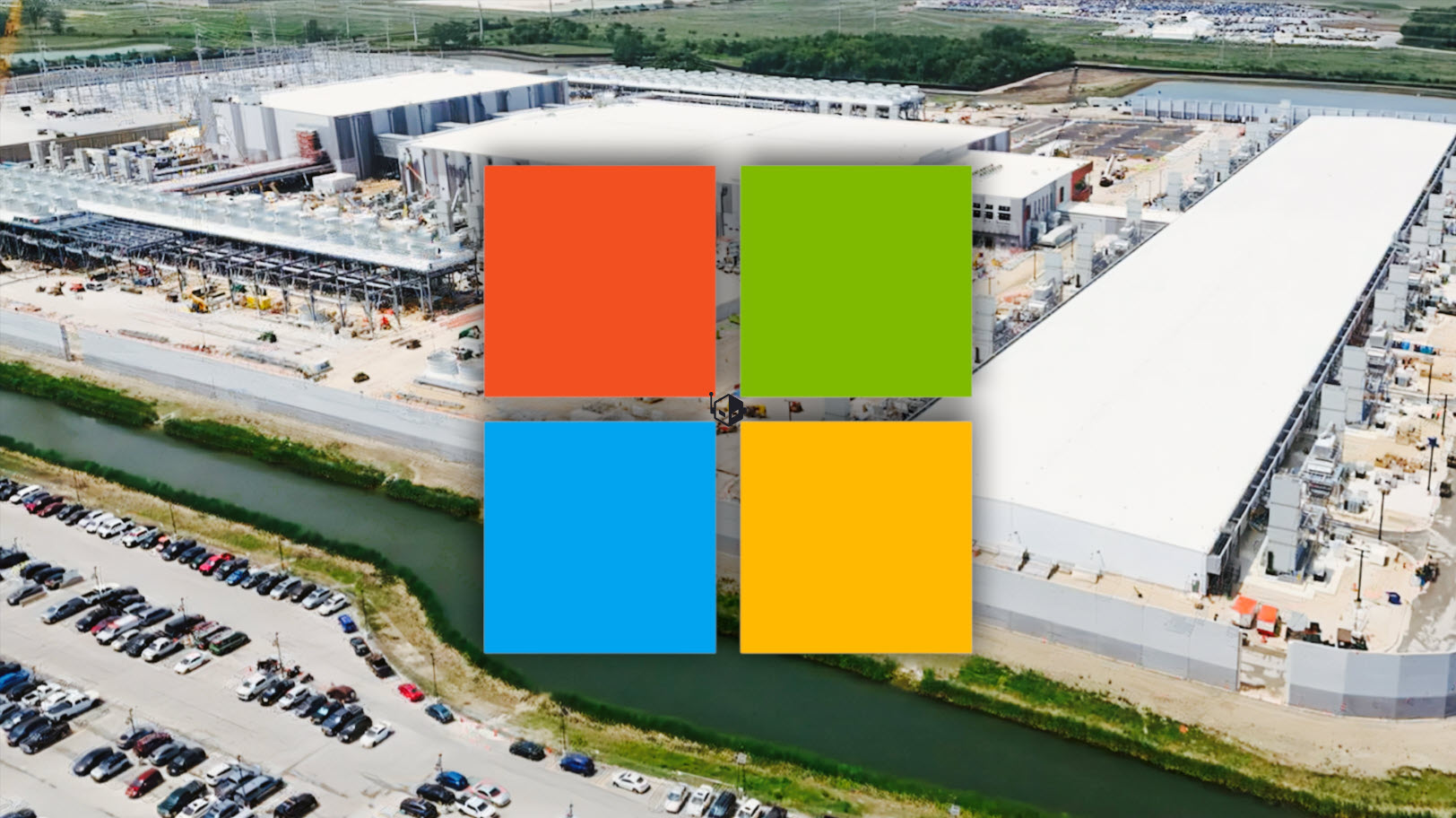 An aerial view of a large Microsoft data center with the Microsoft logo overlayed in the foreground.