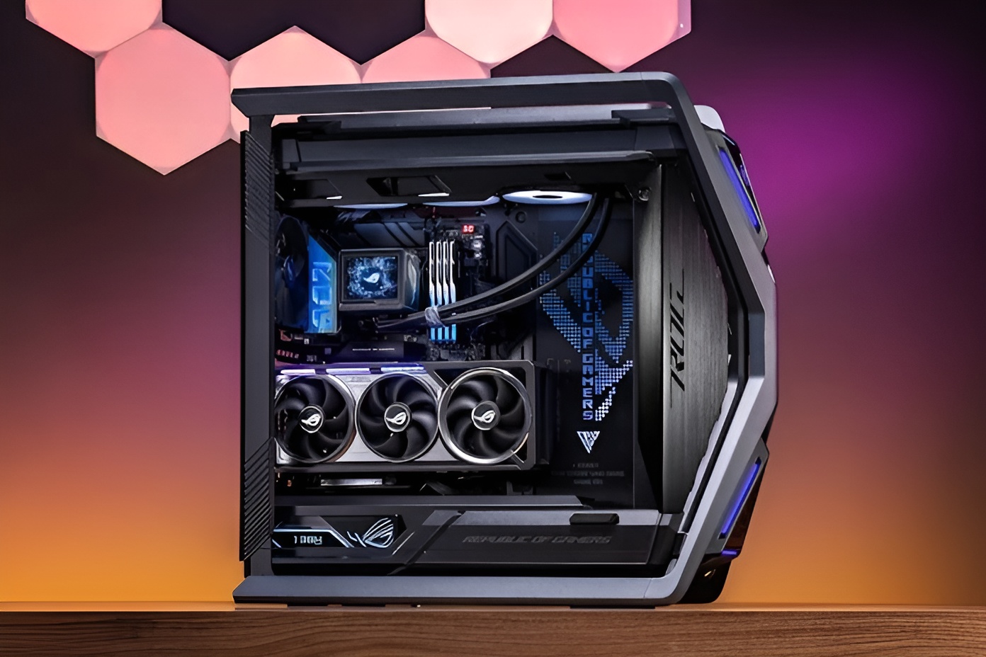 A high-end gaming PC featuring an ASUS ROG Strix graphics card with triple fans inside a ROG branded case with LED lighting.