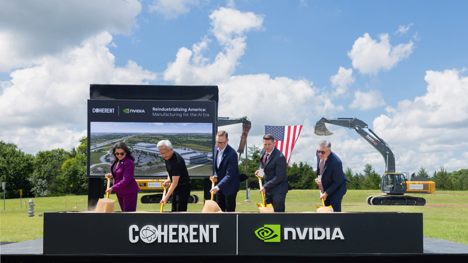 Executives participate in a groundbreaking event in front of a sign featuring 'Coherent' and 'NVIDIA' logos with the text 'Reindustrializing America: Manufacturing for the AI Era.'