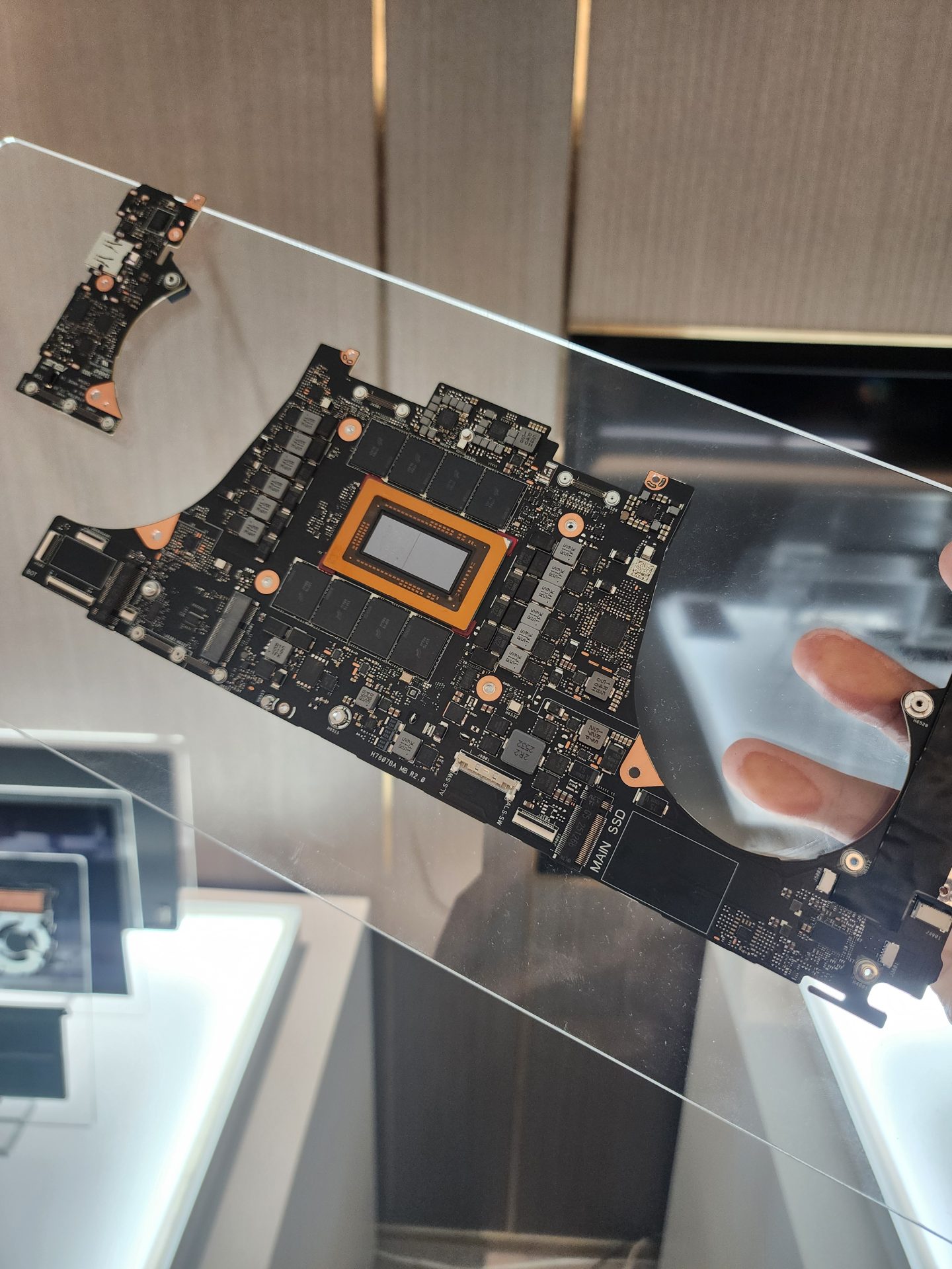 An AMD motherboard with visible components, including an