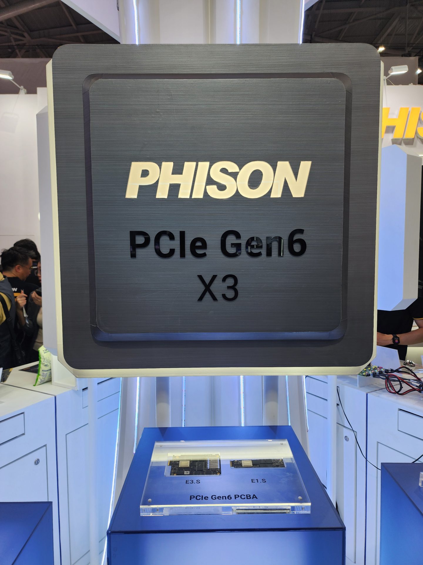 A display featuring Phison's 'PCIe Gen6 X3' technology with E3.S and E1.S modules labeled as 'PCIe Gen6 PCBA'.