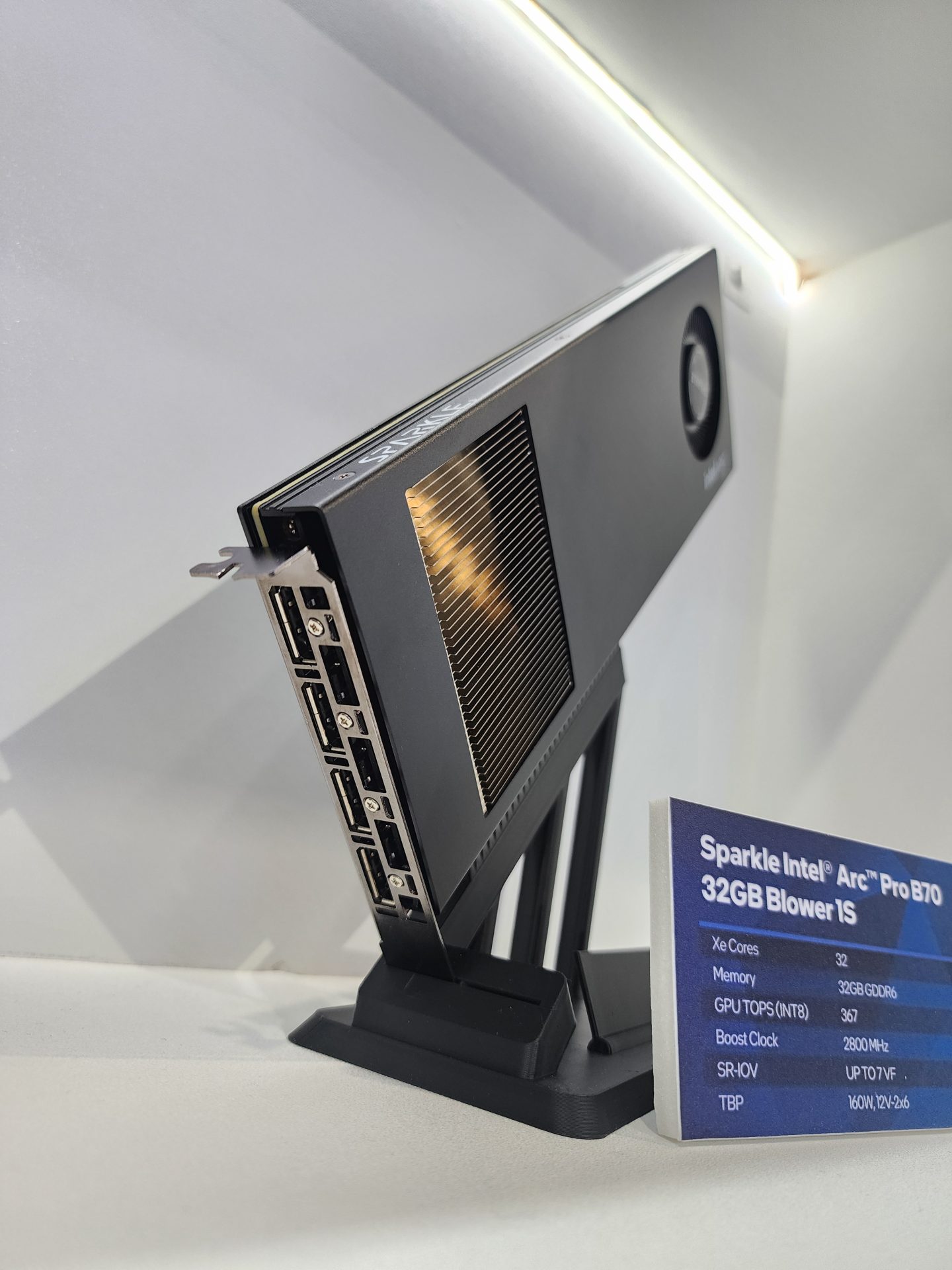 The image shows a Sparkle Intel Arc Pro B70 graphics card with a 32GB GDDR6 memory, displayed vertically alongside a specifications card detailing '32 Xe Cores,' 'GPU TOPS (INT8) 362,' 'Boost Clock 2800 MHz,' and 'TBP 160W, 120W-2x6.'