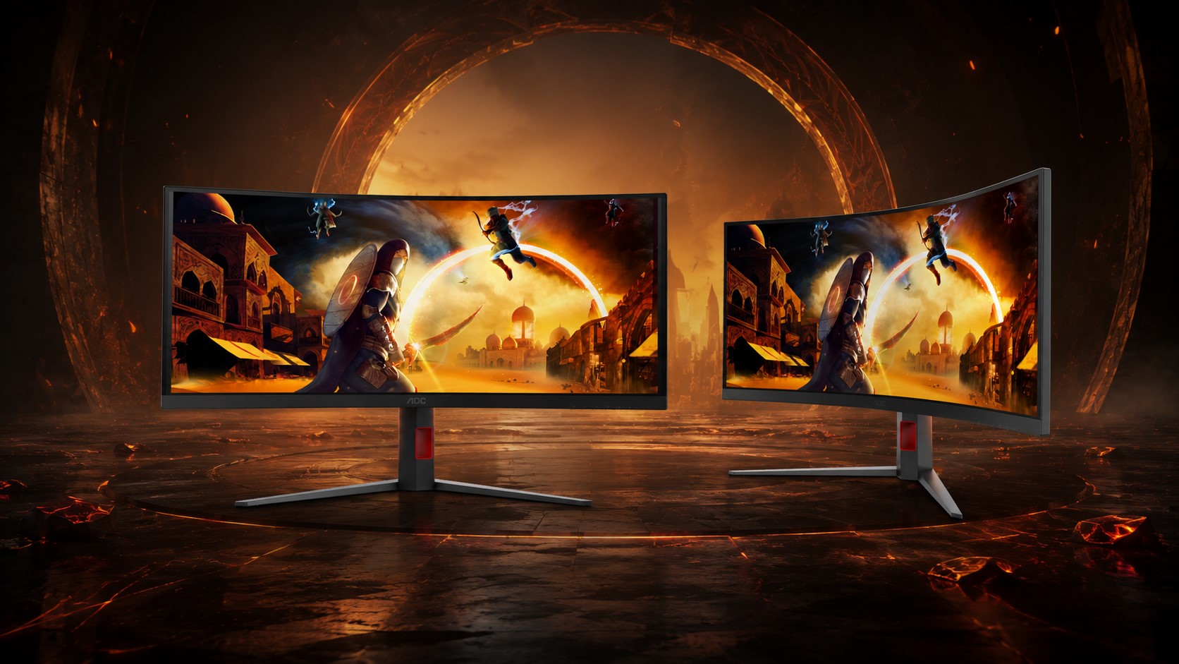 Two AOC gaming monitors display an action scene from a fantasy game featuring a warrior with a shield and fighters leaping through a sunset-lit cityscape.