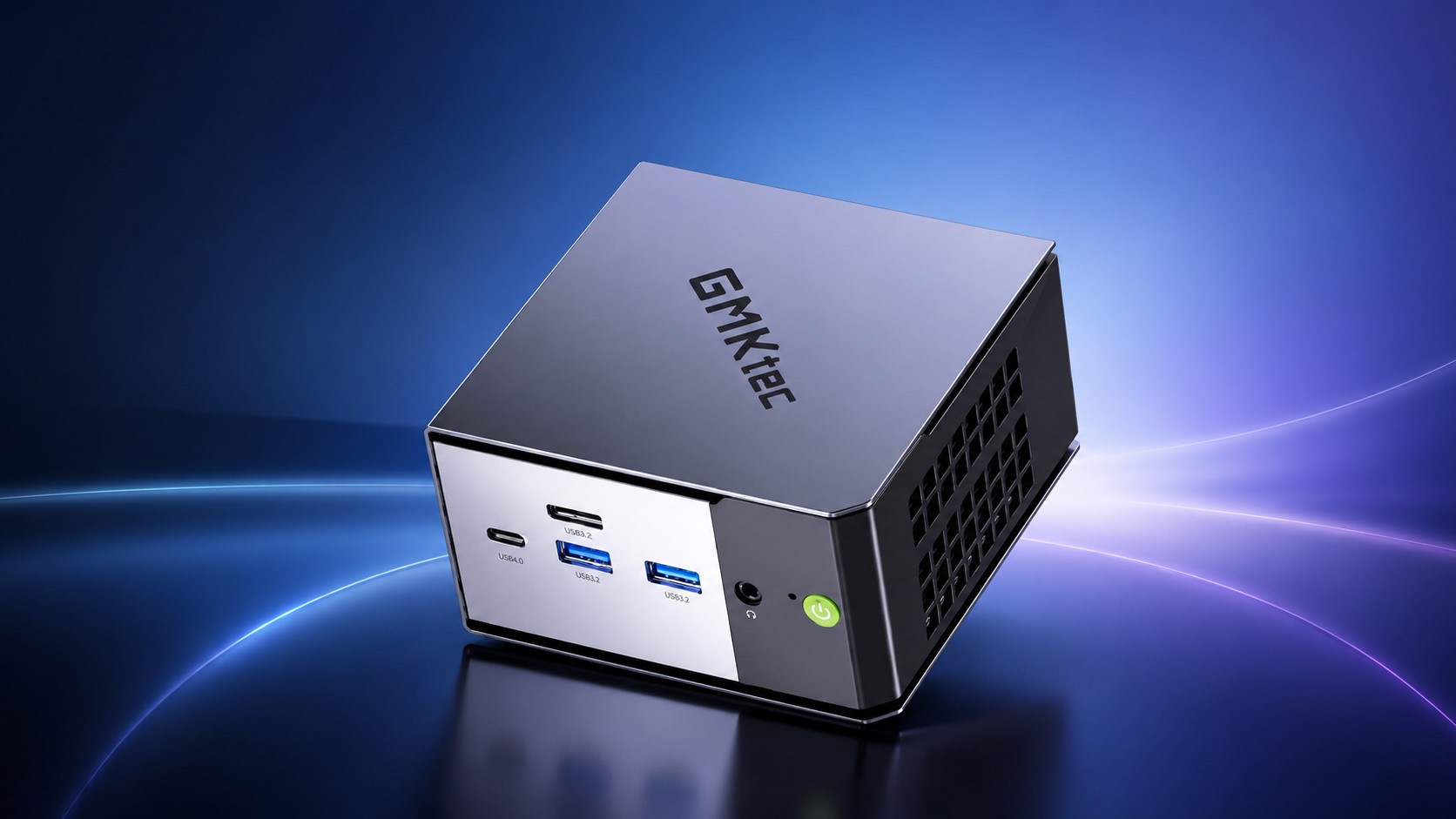 A GMKtec mini PC is shown with a silver casing and various ports, including USB4.0 and USB3.2, against a blue gradient background.