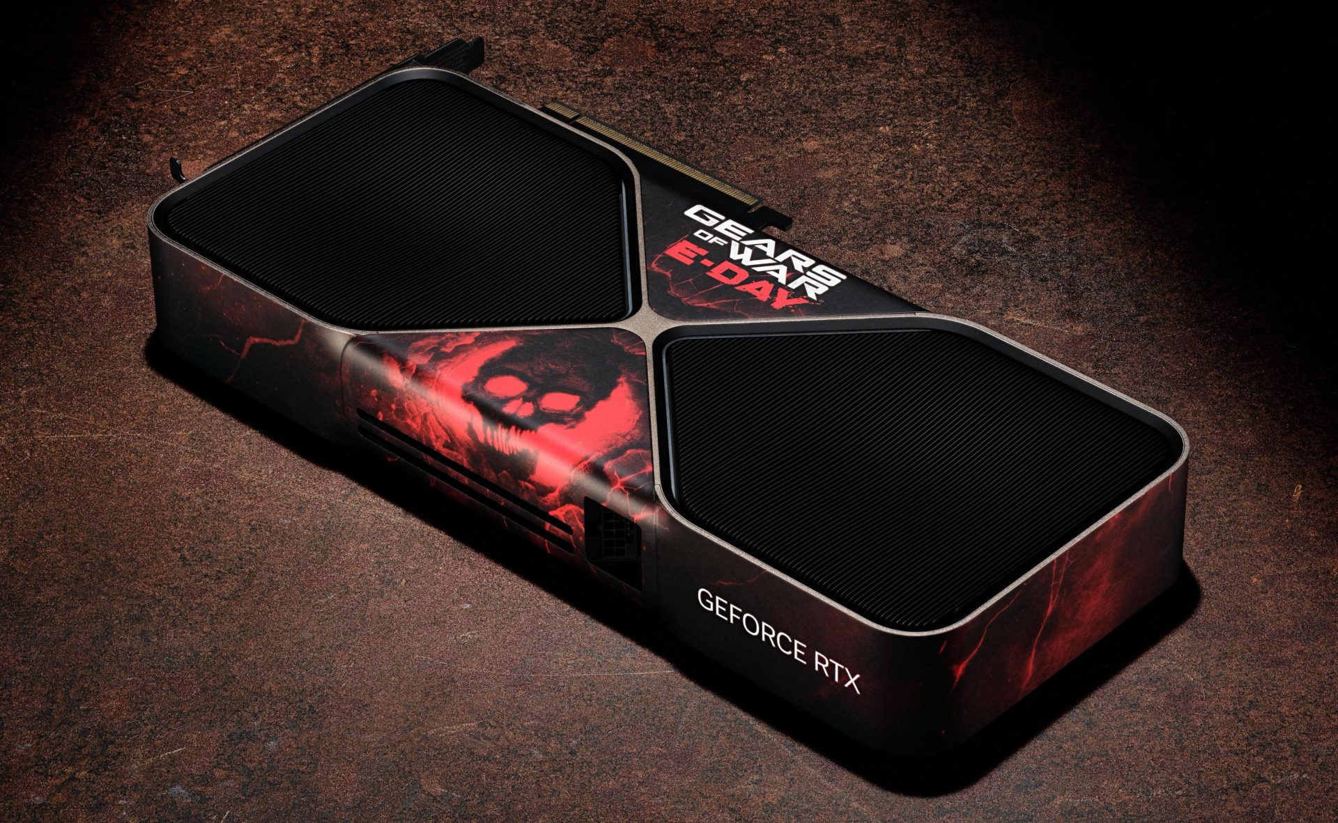 A custom NVIDIA GeForce RTX graphics card with a Gears of War themed design featuring red and black artwork and the words 'E-Day' on its surface.